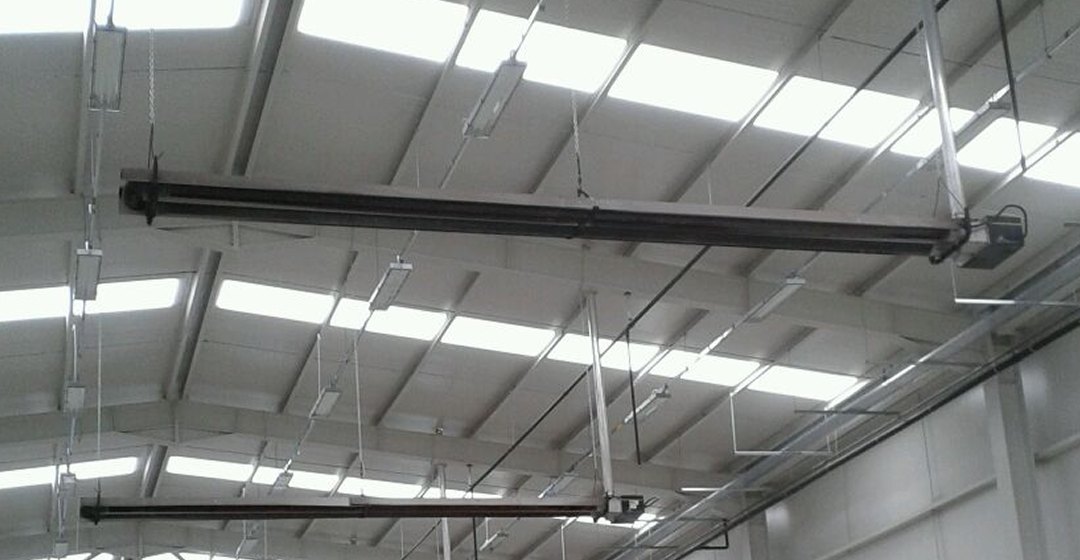 HB Radiance radiant heating lines installed under the roof of an industrial building
